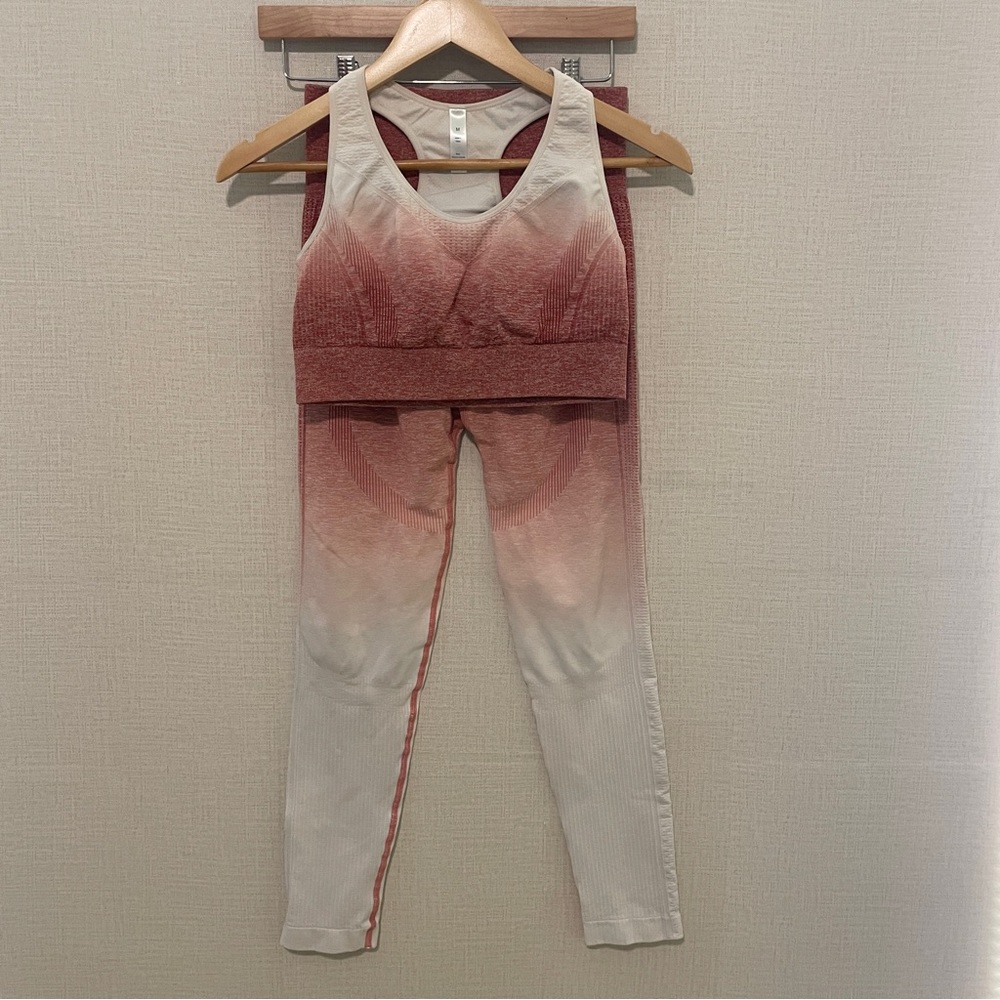 Pink ombré sports bra and leggings set. Size: medium